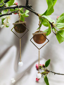 Golden Dangly Earrings with a White Accent