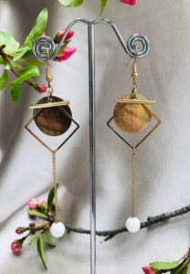 Golden Dangly Earrings with a White Accent